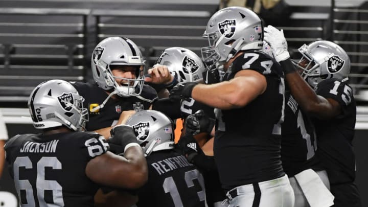LAS VEGAS, NEVADA - SEPTEMBER 21: The Las Vegas Raiders celebrate in the end zone after quarterback Derek Carr (2nd L) #4 threw a 15-yard touchdown pass to wide receiver Zay Jones #12 against the New Orleans Saints during the first half of the NFL game at Allegiant Stadium on September 21, 2020 in Las Vegas, Nevada. The Raiders defeated the Saints 34-24. (Photo by Ethan Miller/Getty Images)