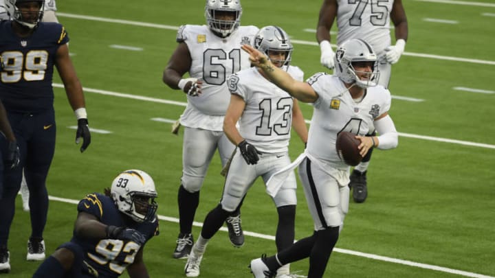 INGLEWOOD, CALIFORNIA - NOVEMBER 08: Derek Carr #4 of the Las Vegas Raiders celebrates a third quarter first down next to Justin Jones #93 of the Los Angeles Chargers at SoFi Stadium on November 08, 2020 in Inglewood, California. (Photo by Harry How/Getty Images)