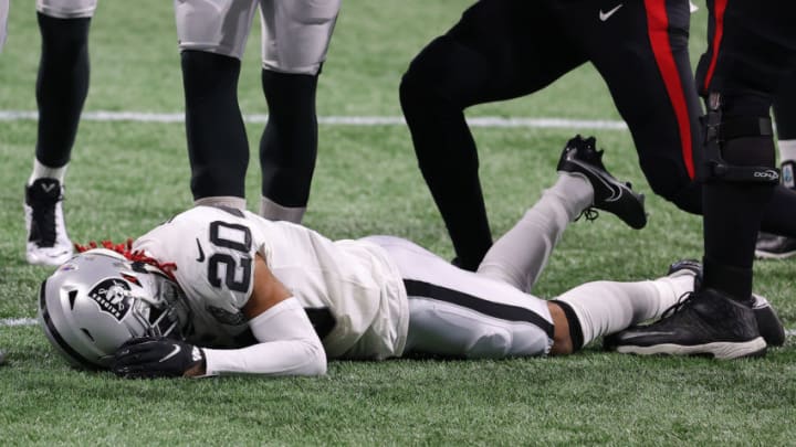 ATLANTA, GEORGIA - NOVEMBER 29: Damon Arnette #20 of the Las Vegas Raiders lays on the field after a the opening kickoff against the Atlanta Falcons at Mercedes-Benz Stadium on November 29, 2020 in Atlanta, Georgia. (Photo by Kevin C. Cox/Getty Images)