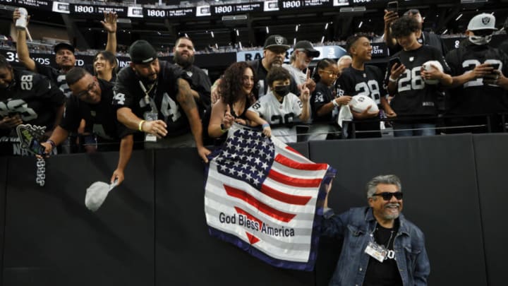 LAS VEGAS, NEVADA - SEPTEMBER 13: Actor/comedian George Lopez poses with fans before the game between the Las Vegas Raiders and the Baltimore Ravens at Allegiant Stadium on September 13, 2021 in Las Vegas, Nevada. (Photo by Ethan Miller/Getty Images)