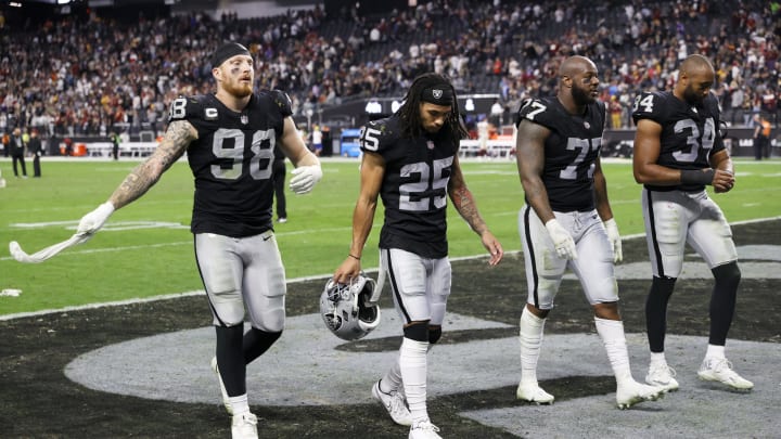 LAS VEGAS, NEVADA – DECEMBER 05: Defensive end Maxx Crosby #98, free safety Trevon Moehrig #25, defensive tackle Quinton Jefferson #77, and outside linebacker K.J. Wright #34 of the Las Vegas Raiders walk off the field following the team’s 17-15 loss to the Washington Football Team at Allegiant Stadium on December 5, 2021, in Las Vegas, Nevada. (Photo by Ethan Miller/Getty Images)