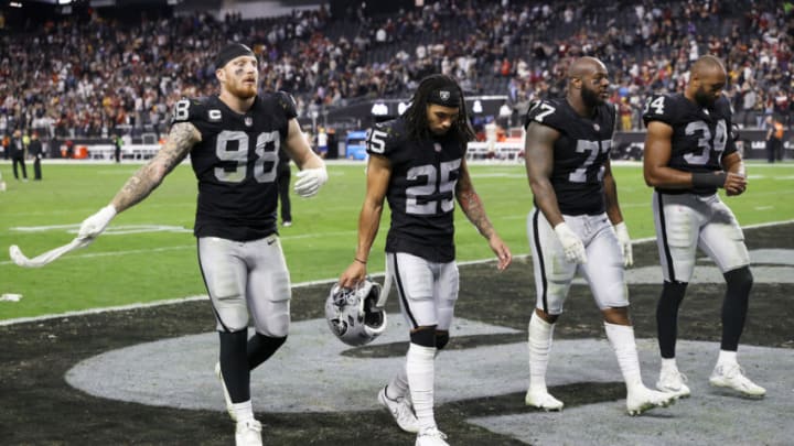 LAS VEGAS, NEVADA - DECEMBER 05: Defensive end Maxx Crosby #98, free safety Trevon Moehrig #25, defensive tackle Quinton Jefferson #77 and outside linebacker K.J. Wright #34 of the Las Vegas Raiders walk off the field following the team's 17-15 loss to the Washington Football Team at Allegiant Stadium on December 5, 2021 in Las Vegas, Nevada. (Photo by Ethan Miller/Getty Images)