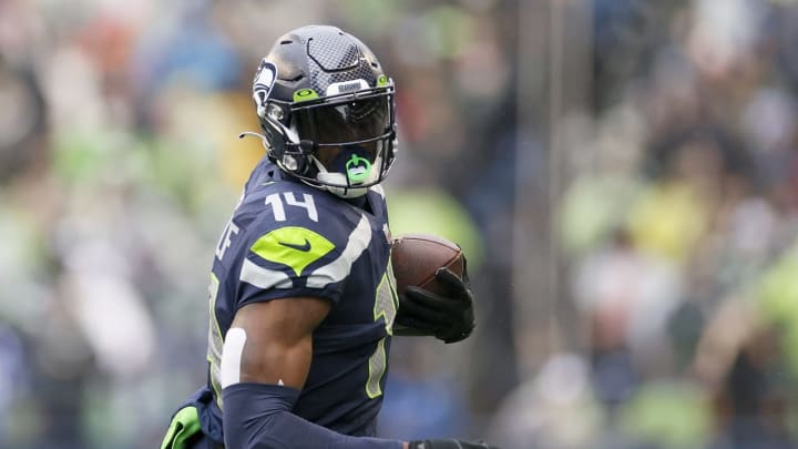 SEATTLE, WASHINGTON – JANUARY 02: DK Metcalf #14 of the Seattle Seahawks carries the ball against the Detroit Lions during the first half at Lumen Field on January 02, 2022, in Seattle, Washington. (Photo by Steph Chambers/Getty Images)