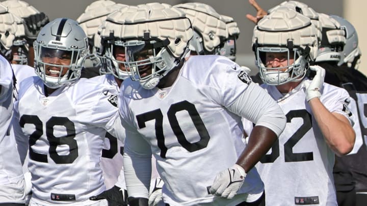 HENDERSON, NEVADA – JULY 24: Running back Josh Jacobs #28, guard Alex Leatherwood #70, and tight end Nick Bowers #82 of the Las Vegas Raiders practice during training camp at the Las Vegas Raiders Headquarters/Intermountain Healthcare Performance Center on July 24, 2022, in Henderson, Nevada. (Photo by Ethan Miller/Getty Images)