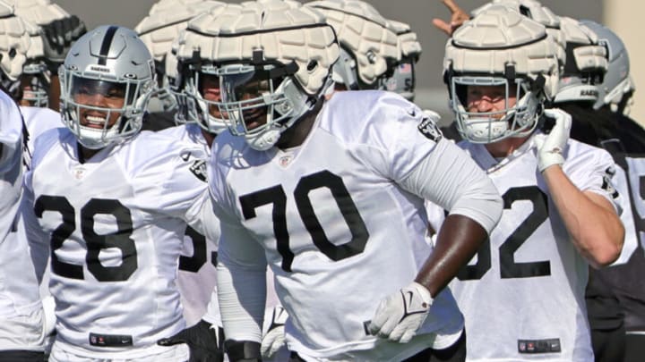 HENDERSON, NEVADA - JULY 24: Running back Josh Jacobs #28, guard Alex Leatherwood #70 and tight end Nick Bowers #82 of the Las Vegas Raiders practice during training camp at the Las Vegas Raiders Headquarters/Intermountain Healthcare Performance Center on July 24, 2022 in Henderson, Nevada. (Photo by Ethan Miller/Getty Images)