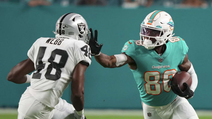 MIAMI GARDENS, FLORIDA – AUGUST 20: Braylon Sanders #86 of the Miami Dolphins stiff arms Sam Webb #48 of the Las Vegas Raiders during the second quarter of the preseason game at Hard Rock Stadium on August 20, 2022, in Miami Gardens, Florida. (Photo by Eric Espada/Getty Images)