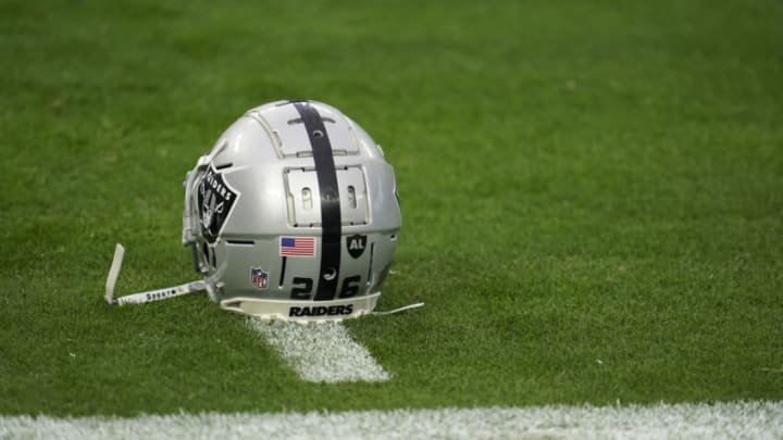 LAS VEGAS, NEVADA - DECEMBER 13: A close up view of the official helmet worn by Nevin Lawson #26 of the Las Vegas Raiders prior to an NFL game against the Indianapolis Colts on December 13, 2020 in Las Vegas, Nevada. (Photo by Cooper Neill/Getty Images)