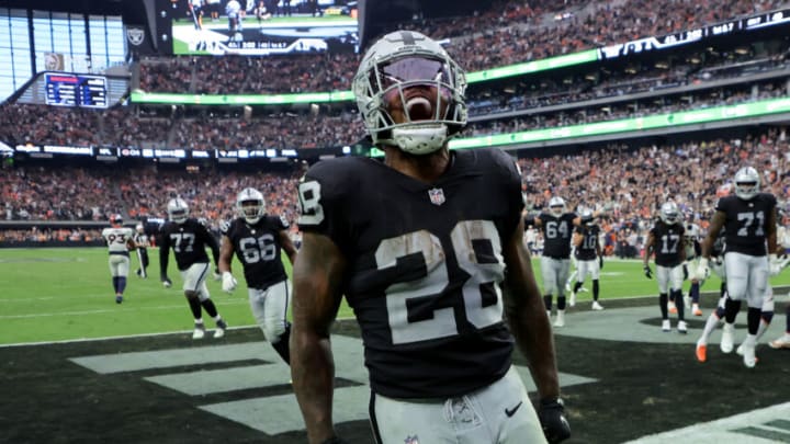 LAS VEGAS, NEVADA - OCTOBER 02: Josh Jacobs #28 of the Las Vegas Raiders celebrates after scoring a touchdown in the fourth quarter against the Denver Broncos at Allegiant Stadium on October 02, 2022 in Las Vegas, Nevada. (Photo by Ethan Miller/Getty Images)