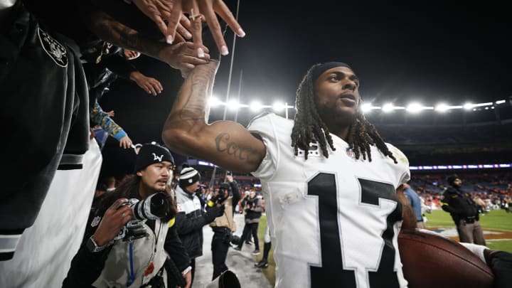 DENVER, COLORADO – NOVEMBER 20: Davante Adams #17 of the Las Vegas Raiders celebrates with fans following an NFL game between the Las Vegas Raiders and Denver Broncos at Empower Field At Mile High on November 20, 2022 in Denver, Colorado. The Las Vegas Raiders won in overtime (Photo by Michael Owens/Getty Images)