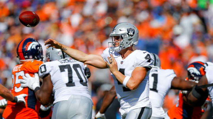 DENVER, CO - SEPTEMBER 16: Quarterback Derek Carr #4 of the Oakland Raiders passes against the Denver Broncos at Broncos Stadium at Mile High on September 16, 2018 in Denver, Colorado. (Photo by Justin Edmonds/Getty Images)