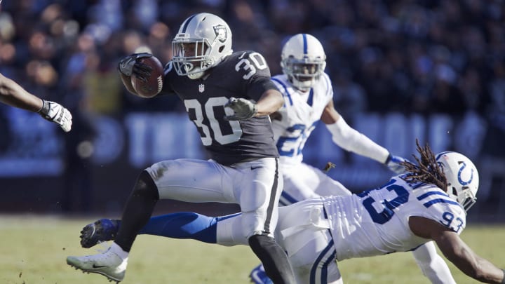 OAKLAND, CA – DECEMBER 24: Running back Jalen Richard #30 of the Oakland Raiders picks up 19 yards on a carry against outside linebacker Erik Walden #93 of the Indianapolis Colts in the second quarter on December 24, 2016 at Oakland-Alameda County Coliseum in Oakland, California. The Raiders won 33-25. (Photo by Brian Bahr/Getty Images)