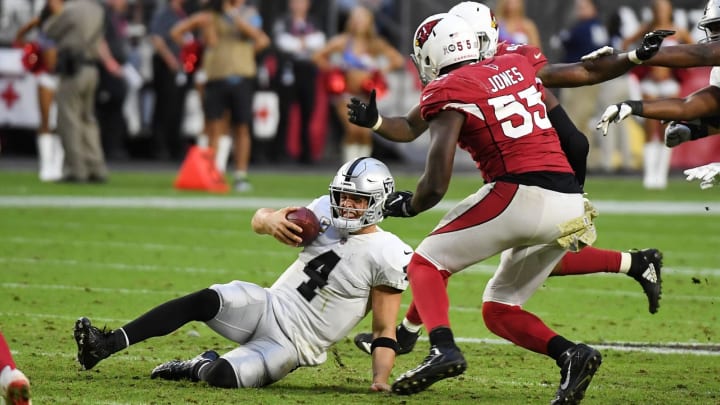 GLENDALE, AZ – NOVEMBER 18: Derek Carr #4 of the Oakland Raiders slides just before getting hit by Chandler Jones #55 of the Arizona Cardinals at State Farm Stadium on November 18, 2018 in Glendale, Arizona. Raiders won 23-21. (Photo by Norm Hall/Getty Images)