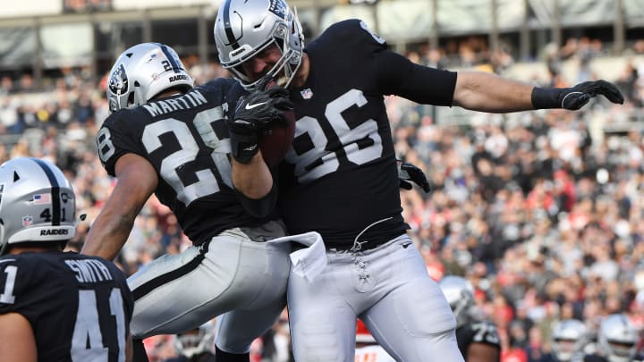 OAKLAND, CA – DECEMBER 02: Lee Smith #86 of the Oakland Raiders celebrates with Doug Martin #28 after scoring on a one-yard catch against the Kansas City Chiefs during their NFL game at Oakland-Alameda County Coliseum on December 2, 2018 in Oakland, California. (Photo by Thearon W. Henderson/Getty Images)