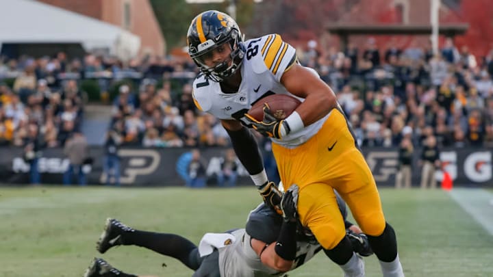 WEST LAFAYETTE, IN - NOVEMBER 03: Noah Fant #87 of the Iowa Hawkeyes runs the ball after a catch as Jacob Thieneman #41 of the Purdue Boilermakers tries to make the stop at Ross-Ade Stadium on November 3, 2018 in West Lafayette, Indiana. (Photo by Michael Hickey/Getty Images)