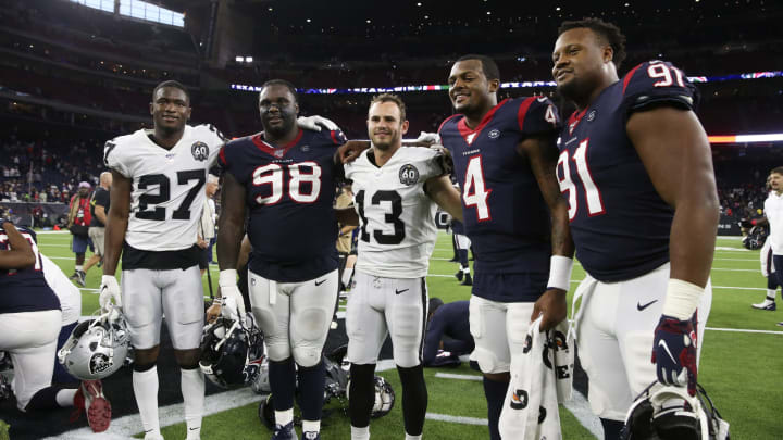 Oct 27, 2019; Houston, TX, USA; Oakland Raiders cornerback Trayvon Mullen (27) and wide receiver Hunter Renfrow (13) and Houston Texans defensive end D.J. Reader (98) and quarterback Deshaun Watson (4) and defensive end Carlos Watkins (91) pose for a photo after the game at NRG Stadium. Mandatory Credit: Kevin Jairaj-USA TODAY Sports