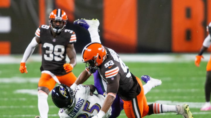 Dec 14, 2020; Cleveland, Ohio, USA; Cleveland Browns middle linebacker B.J. Goodson (93) tackles Baltimore Ravens running back Gus Edwards (35) during the first quarter at FirstEnergy Stadium. Mandatory Credit: Scott Galvin-USA TODAY Sports