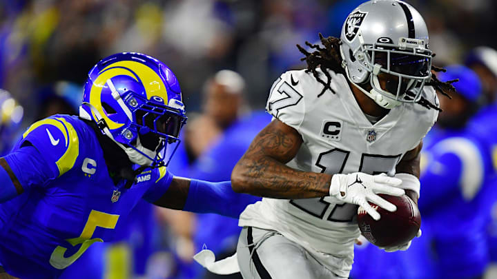 Dec 8, 2022; Inglewood, California, USA; Las Vegas Raiders wide receiver Davante Adams (17) catches a pass against Los Angeles Rams cornerback Jalen Ramsey (5) during the first half at SoFi Stadium. Mandatory Credit: Gary A. Vasquez-USA TODAY Sports