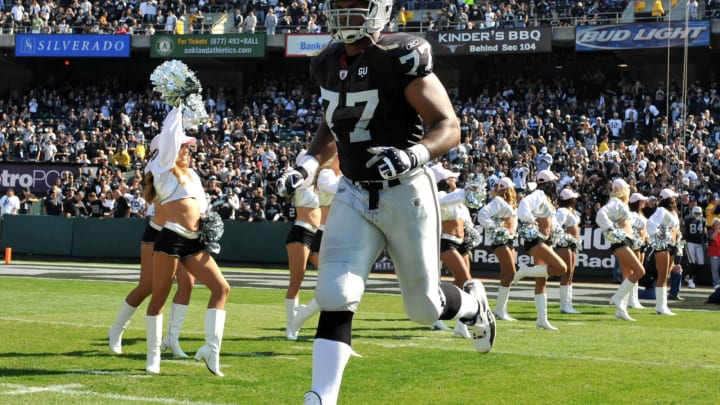 Oct 19, 2008; Oakland, CA, USA; Oakland Raiders tackle Kwame Harris (77) is introduced before the game against the New York Jets at the Oakland Coliseum. Mandatory Credit: Kirby Lee/Image of Sport-USA TODAY Sports