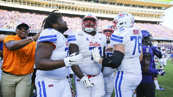 Sep 21, 2019; Fort Worth, TX, USA; Southern Methodist Mustangs offensive lineman Jaylon Thomas (71) and offensive lineman Beau Morris (78) celebrate the victory against the TCU Horned Frogs at Amon G. Carter Stadium. Mandatory Credit: Kevin Jairaj-USA TODAY Sports