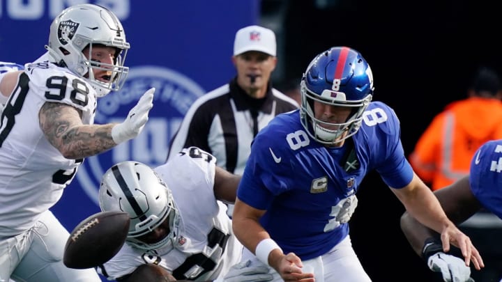 Nov 7, 2021; East Rutherford, N.J., USA;Las Vegas Raiders defensive end Yannick Ngakoue (91) sacks New York Giants quarterback Daniel Jones (8) and causes a fumble that the Raiders recovered in the first half at MetLife Stadium. Mandatory Credit: Robert Deutsch-USA TODAY Sports