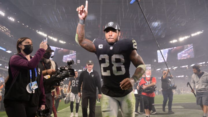 Jan 9, 2022; Paradise, Nevada, USA; Las Vegas Raiders running back Josh Jacobs (28) gestures as he runs off the field after defeating the Los Angeles Chargers at Allegiant Stadium. Mandatory Credit: Orlando Ramirez-USA TODAY Sports