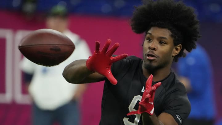 Mar 3, 2022; Indianapolis, IN, USA; Mississippi wide receiver Dontario Drummond (WO09) goes through drills during the 2022 NFL Scouting Combine at Lucas Oil Stadium. Mandatory Credit: Kirby Lee-USA TODAY Sports