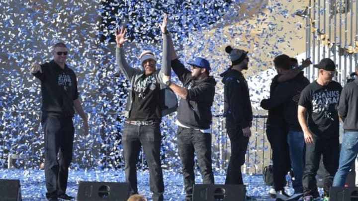 Nov 3, 2015; Kansas City, MO, USA; Kansas City Royals catcher Salvador Perez (13) and third baseman Mike Moustakas (8) celebrate the World Series championship at Union Station. Mandatory Credit: Denny Medley-USA TODAY Sports