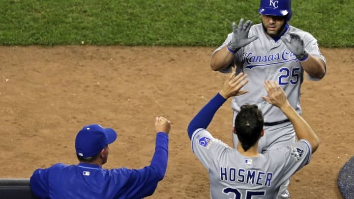 May 11, 2016; Bronx, NY, USA; Kansas City Royals designated hitter Kendrys Morales (25) celebrates with Eric Hosmer (35) after hitting a solo home run against the New York Yankees during the seventh inning at Yankee Stadium. Mandatory Credit: Adam Hunger-USA TODAY Sports