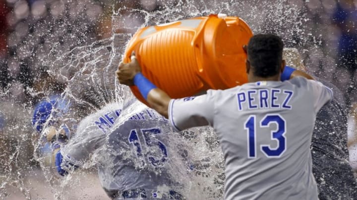 May 24, 2016; Minneapolis, MN, USA; Kansas City Royals catcher Salvador Perez (13) dumps a bucket of water on second baseman Whit Merrifield (15) after they defeat the Minnesota Twins 7-4 at Target Field. Mandatory Credit: Bruce Kluckhohn-USA TODAY Sports