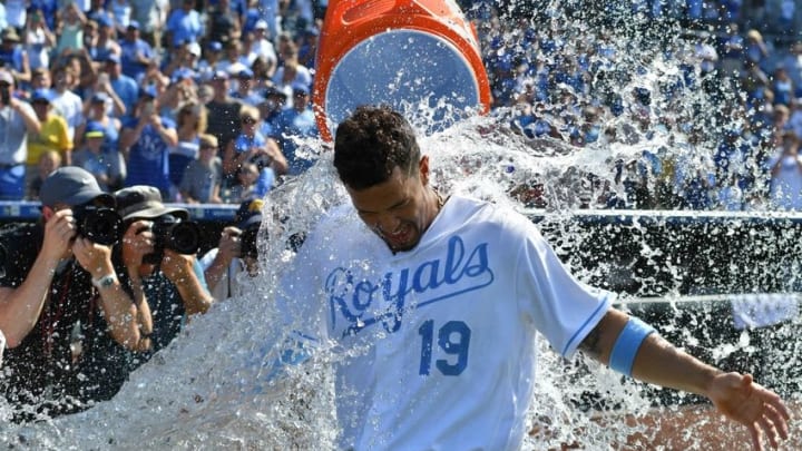 Jun 19, 2016; Kansas City, MO, USA; Kansas City Royals third baseman Cheslor Cuthbert (19) gets doused by catcher Salvador Perez (not pictured) after hitting the game winning walk off single in the thirteenth inning over the Detroit Tigers at Kauffman Stadium. The Royals won 2-1. Mandatory Credit: Denny Medley-USA TODAY Sports