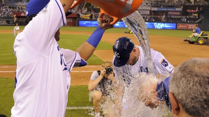 Aug 11, 2016; Kansas City, MO, USA; Kansas City Royals catcher Salvador Perez (13) dumps the water cooler on starting pitcher Danny Duffy (41) after the game against the Chicago White Sox at Kauffman Stadium. Kansas City won the game 2-1. Mandatory Credit: John Rieger-USA TODAY Sports