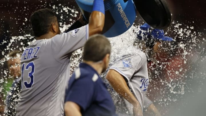 Aug 28, 2016; Boston, MA, USA; KC Royals catcher Salvador Perez (13) dumps the powerade bucket on first baseman Eric Hosmer (35) after defeating the Boston Red Sox 10-4 at Fenway Park. Mandatory Credit: Greg M. Cooper-USA TODAY Sports