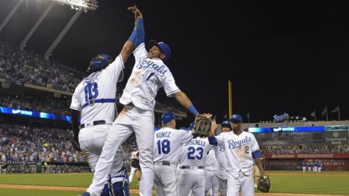 Sep 3, 2016; Kansas City, MO, USA; Kansas City Royals center fielder Jarrod Dyson (1) celebrates with catcher Salvador Perez (13) after the win over the Detroit Tigers at Kauffman Stadium. The Royals won 5-2. Mandatory Credit: Denny Medley-USA TODAY Sports