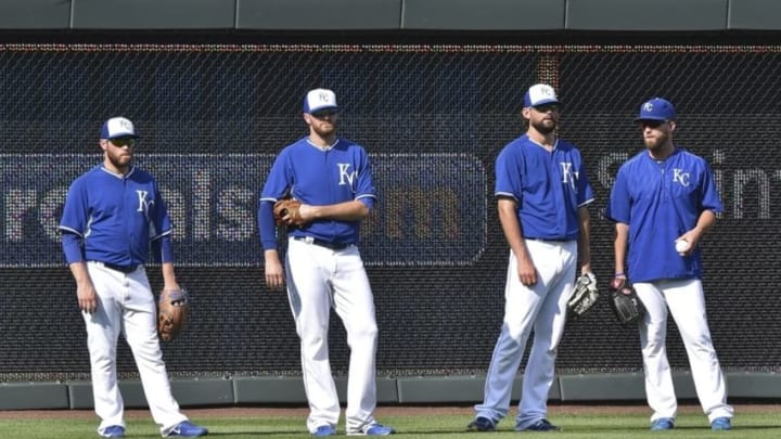Aug 7, 2015; Kansas City, MO, USA; Kansas City Royals pitchers Greg Holland (far left), Wade Davis (left center), Luke Hochevar (right center) and Danny Duffy (far right) stand in the out field during batting practice prior to a game against the Chicago White Sox at Kauffman Stadium. Mandatory Credit: Peter G. Aiken-USA TODAY Sports