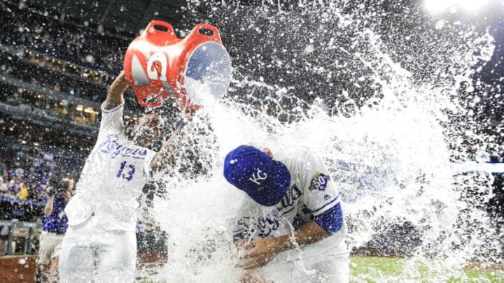 KANSAS CITY, MO - AUGUST 8: Salvador Perez #13 dumps water onto Heath Fillmyer #49 of the Kansas City Royals after the Royals defeated the Chicago Cubs 9-0 at Kauffman Stadium on August 8, 2018 in Kansas City, Missouri. (Photo by Brian Davidson/Getty Images)