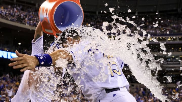 KANSAS CITY, MO - JULY 21: Salvador Perez #13 of the Kansas City Royals dumps water onto Whit Merrifield #15 after Merrifield hit the walk-off sacrifice fly to defeat the Chicago White Sox 7-6 in the tenth inning at Kauffman Stadium on July 21, 2017 in Kansas City, Missouri. (Photo by Brian Davidson/Getty Images)