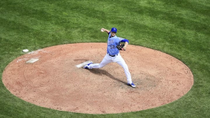 KANSAS CITY, MO - APRIL 11: Justin Grimm #52 of the Kansas City Royals pitches against the Seattle Mariners during the eighth inning at Kauffman Stadium on April 11, 2018 in Kansas City, Missouri. (Photo by Brian Davidson/Getty Images)