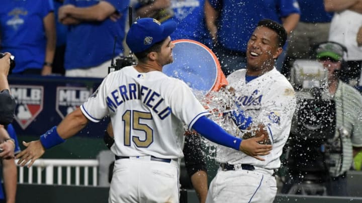 KANSAS CITY, MO - MAY 18: Whit Merrifield #15 of the Kansas City Royals is doused with water by Salvador Perez #13 as they celebrate a 5-2 won over the New York Yankees Kauffman Stadium on May 18, 2018 in Kansas City, Missouri. (Photo by Ed Zurga/Getty Images)