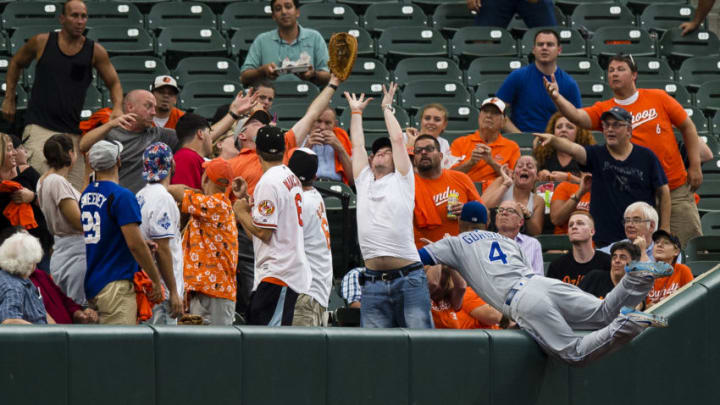 BALTIMORE, MD - AUGUST 01: Alex Gordon #4 of the Kansas City Royals is unable to catch a foul ball hit by Adam Jones #10 of the Baltimore Orioles (not pictured) in the second inning during a game at Oriole Park at Camden Yards on August 1, 2017 in Baltimore, Maryland. (Photo by Patrick McDermott/Getty Images)