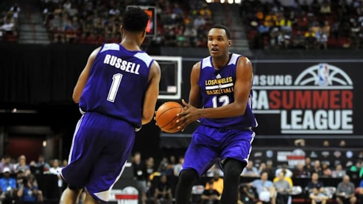 Jul 11, 2015; Las Vegas, NV, USA; Los Angeles Lakers center Robert Upshaw (12) passes the ball to guard D'Angelo Russell (1) during an NBA Summer League game against the Philadelphia 76ers at Thomas & Mack Center. The Lakers won 68-60. Mandatory Credit: Stephen R. Sylvanie-USA TODAY Sports