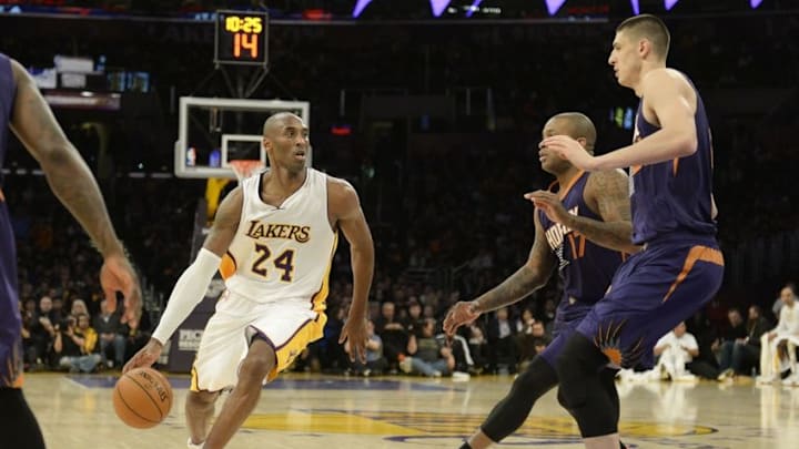 Dec 28, 2014; Los Angeles, CA, USA; Los Angeles Lakers guard Kobe Bryant (24) drives against the Phoenix Suns during the second half at Staples Center. Mandatory Credit: Richard Mackson-USA TODAY Sports Dec 28, 2014; Los Angeles, CA, USA; Los Angeles Lakers guard Kobe Bryant (24) drives against the Phoenix Suns during the second half at Staples Center. Mandatory Credit: Richard Mackson-USA TODAY Sports
