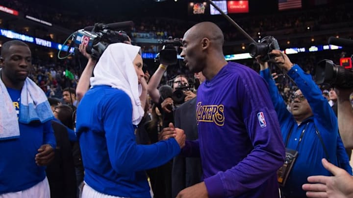 January 14, 2016; Oakland, CA, USA; Golden State Warriors guard Stephen Curry (30, left) shakes hands with Los Angeles Lakers forward Kobe Bryant (24, right) after the game at Oracle Arena. The Warriors defeated the Lakers 116-98. Mandatory Credit: Kyle Terada-USA TODAY Sports