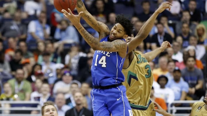 Mar 10, 2016; Washington, DC, USA; Duke Blue Devils guard Brandon Ingram (14) and Notre Dame Fighting Irish forward V.J. Beachem (3) battle for a rebound in the second half during day three of the ACC conference tournament at Verizon Center. The Fighting Irish won 84-79 in overtime. Mandatory Credit: Geoff Burke-USA TODAY Sports