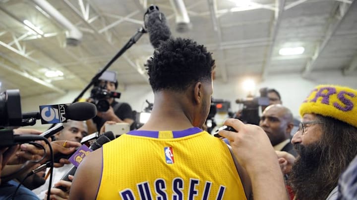 Mar 23, 2016; Phoenix, AZ, USA; Los Angeles Lakers forward Larry Nance Jr. (7) and guard D'Angelo Russell (1) against the Phoenix Suns at Talking Stick Resort Arena. The Suns defeated the Lakers 119-107. Mandatory Credit: Mark J. Rebilas-USA TODAY Sports