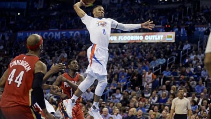 Feb 11, 2016; Oklahoma City, OK, USA; Oklahoma City Thunder guard Russell Westbrook (0) dunks the ball against the New Orleans Pelicans during the third quarter at Chesapeake Energy Arena. Mandatory Credit: Mark D. Smith-USA TODAY Sports