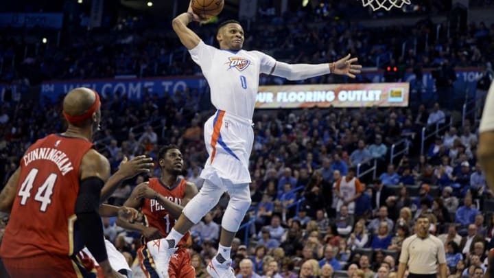 Feb 11, 2016; Oklahoma City, OK, USA; Oklahoma City Thunder guard Russell Westbrook (0) dunks the ball against the New Orleans Pelicans during the third quarter at Chesapeake Energy Arena. Mandatory Credit: Mark D. Smith-USA TODAY Sports