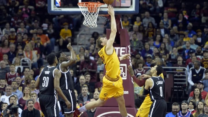 Mar 31, 2016; Cleveland, OH, USA; Cleveland Cavaliers center Timofey Mozgov (20) makes a reverse layup in the second quarter against the Brooklyn Nets at Quicken Loans Arena. Mandatory Credit: David Richard-USA TODAY Sports