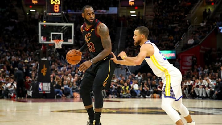 CLEVELAND, OH - JUNE 08: LeBron James #23 of the Cleveland Cavaliers drives to the basket defended by Stephen Curry #30 of the Golden State Warriors during Game Four of the 2018 NBA Finals at Quicken Loans Arena on June 8, 2018 in Cleveland, Ohio. NOTE TO USER: User expressly acknowledges and agrees that, by downloading and or using this photograph, User is consenting to the terms and conditions of the Getty Images License Agreement. (Photo by Gregory Shamus/Getty Images)