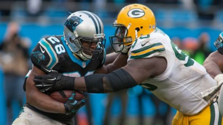 Nov 8, 2015; Charlotte, NC, USA; Carolina Panthers running back Jonathan Stewart (28) runs the ball against Green Bay Packers nose tackle Letroy Guion (98) during the fourth quarter at Bank of America Stadium. The Panthers defeated the Packers 37-29. Mandatory Credit: Jeremy Brevard-USA TODAY Sports