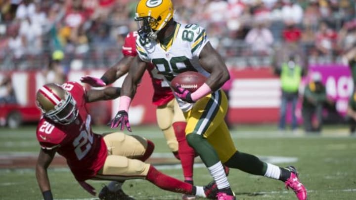 October 4, 2015; Santa Clara, CA, USA; Green Bay Packers wide receiver James Jones (89) runs with the football against San Francisco 49ers cornerback Kenneth Acker (20) during the second quarter at Levi